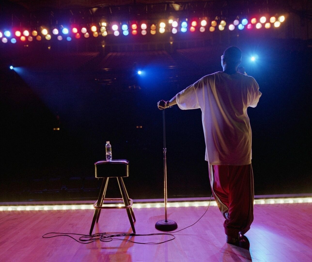 A man standing on the stage with a microphone.